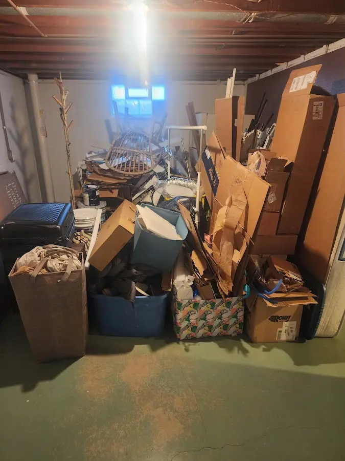 Roll-off dumpster container at job site for Yard Waste Dumpster Rental in Cambridge